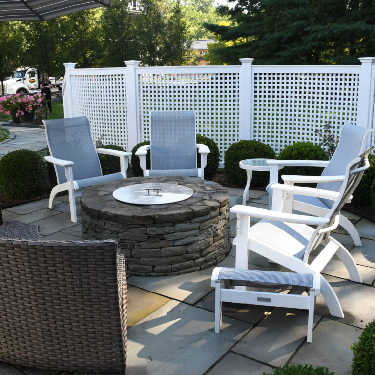 lawn chairs surrounding outdoor firepit -installation